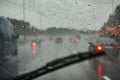 Blurred view of road traffic on a rainy day through the car window Royalty Free Stock Photo