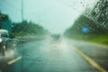 Blurred view of road traffic on a rainy day through the car window Royalty Free Stock Photo