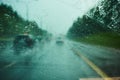 Blurred view of road traffic on a rainy day through the car window Royalty Free Stock Photo