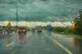 Blurred view of road traffic on a rainy day through the car window Royalty Free Stock Photo