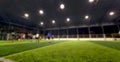 blurred view of soccer or football stadium with players and bright lights used for sport background. Royalty Free Stock Photo