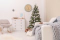 Blurred view of stylish living room interior with Christmas tree Royalty Free Stock Photo