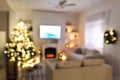 Blurred view of stylish living room interior with decorated Christmas tree and TV set Royalty Free Stock Photo