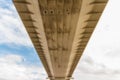 Blurred view Underside of large road suspension bridge, landscape Royalty Free Stock Photo