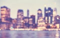 Blurred vintage toned picture of Manhattan skyline at night, NYC Royalty Free Stock Photo