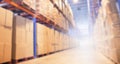 Blurred warehouse commercial business background. cargo logistics, tall shelves, boxes warehouse storage.