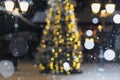 Blurred winter holiday background  falling snow on the background of a Christmas tree decorated Royalty Free Stock Photo