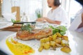 blurred Woman Eating Food Dinner with Grilled steak with potatoes salad Royalty Free Stock Photo