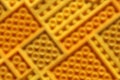Blurred yellow texture of different sizes diagonal rectangles