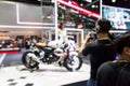 Blurred of young pretty model with motorcycle in moto