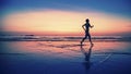 Blurring silhouette of running woman during the bright sunset. Royalty Free Stock Photo