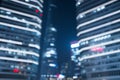 Blurry abstract modern buildings background at night