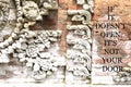 Blurry ancient wall with Inspirational quote - If it doesn`t open , it`s not your door