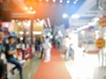 Blurry background of exhibition expo with crowd people in convention hall. Abstract concept. Business marketing and event theme. Royalty Free Stock Photo