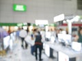 Blurry background of exhibition expo with crowd people in convention hall. Abstract concept. Business marketing and event theme Royalty Free Stock Photo