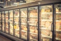 Blurry background frozen pizza in freezer at American supermarket