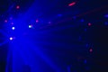 Blurry background with laser blue lights of a disco, dance floor Royalty Free Stock Photo