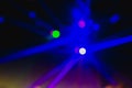 Blurry background with laser blue lights of a disco, dance floor Royalty Free Stock Photo