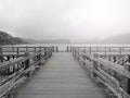 Blurry background of the old wooden bridge with lake view and light in black and white background. Royalty Free Stock Photo