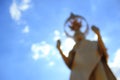 Blurry backlit standing buddha statue. Royalty Free Stock Photo