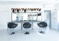 Blurry barber shop interior with wigs on mannequins Royalty Free Stock Photo