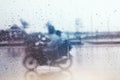 Blurry of biker during hard rainfal. Royalty Free Stock Photo