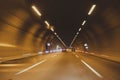 Blurry car tunnel with lights, motion blur background, cars rush through the tunnel Royalty Free Stock Photo