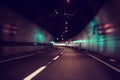 Blurry car tunnel with lights, motion blur background, left turn Royalty Free Stock Photo
