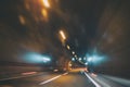 Blurry car tunnel with lights, motion blur background Royalty Free Stock Photo