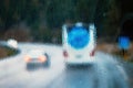 Blurry cars, coach bus on highway traffic in a rainy evening seen through windscreen Royalty Free Stock Photo