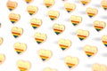 Blurry closeup shot on golden heart with rainbow and word PRIDE inside pattern. June as month of pride concept. on white
