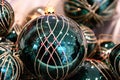 Blurry closeup of traditional green glass ball Christmas ornament. Abstract reflection in sphere surface of Christmas ball. Royalty Free Stock Photo