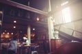 Blurry Coffee shop background in dark tone of light. Royalty Free Stock Photo