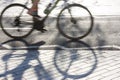 Blurry cyclist silhouette and shadow
