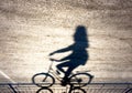 Blurry cyclist silhouette and shadow