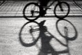 Blurry cyclist silhouette and shadow