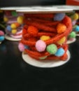 Blurry decorative fluffy colored threads with multicolored balls