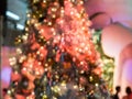 The blurry focus on the red christmas tree with the light decoration, makes it become star shape bokeh everywhere on it. Merry Ch Royalty Free Stock Photo