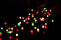 blurry glowing red, green and yellow lights for wallpaper and design isolated on black