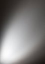 A blurry gray background with a white light shining on it Royalty Free Stock Photo