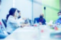 Blurry image of Business people wear masks to prevent Coronavirus Covid-19 in meeting room Royalty Free Stock Photo