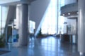 blurry image of a lobby with a cozy interior in a modern office building. Royalty Free Stock Photo