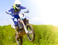 The blurry image of motorcycle rider during motocross race