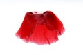 Blurry image of red poppy flower in the shape of a ballet tutu on a white background. Beautiful red flower on white backdrop. Royalty Free Stock Photo