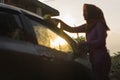 Blurry images of hijab Woman car washing with yellow sponge  washing her car  in front of the house Royalty Free Stock Photo