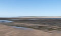 Blurry landscape background, generic sandy coastal scene. ICM.
