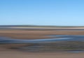 Blurry landscape background, generic sandy coastal scene. ICM.