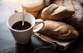 The blurry light design background of ceramic coffee cup put beside group baguette and bun Royalty Free Stock Photo