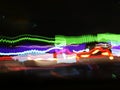 Blurry lights of cars on city streets at night, Light trails from transport - rush hour. Royalty Free Stock Photo