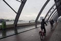 Blurry motion image of people riding a bicycles